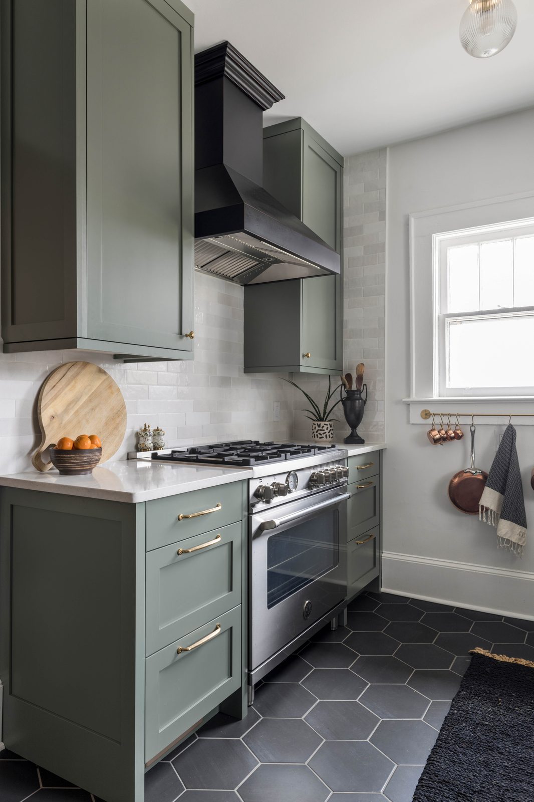 Editorial interior photograph of a kitchen with warm natural light, styled details, and material textures — produced for an interior designer's portfolio and publication submission.