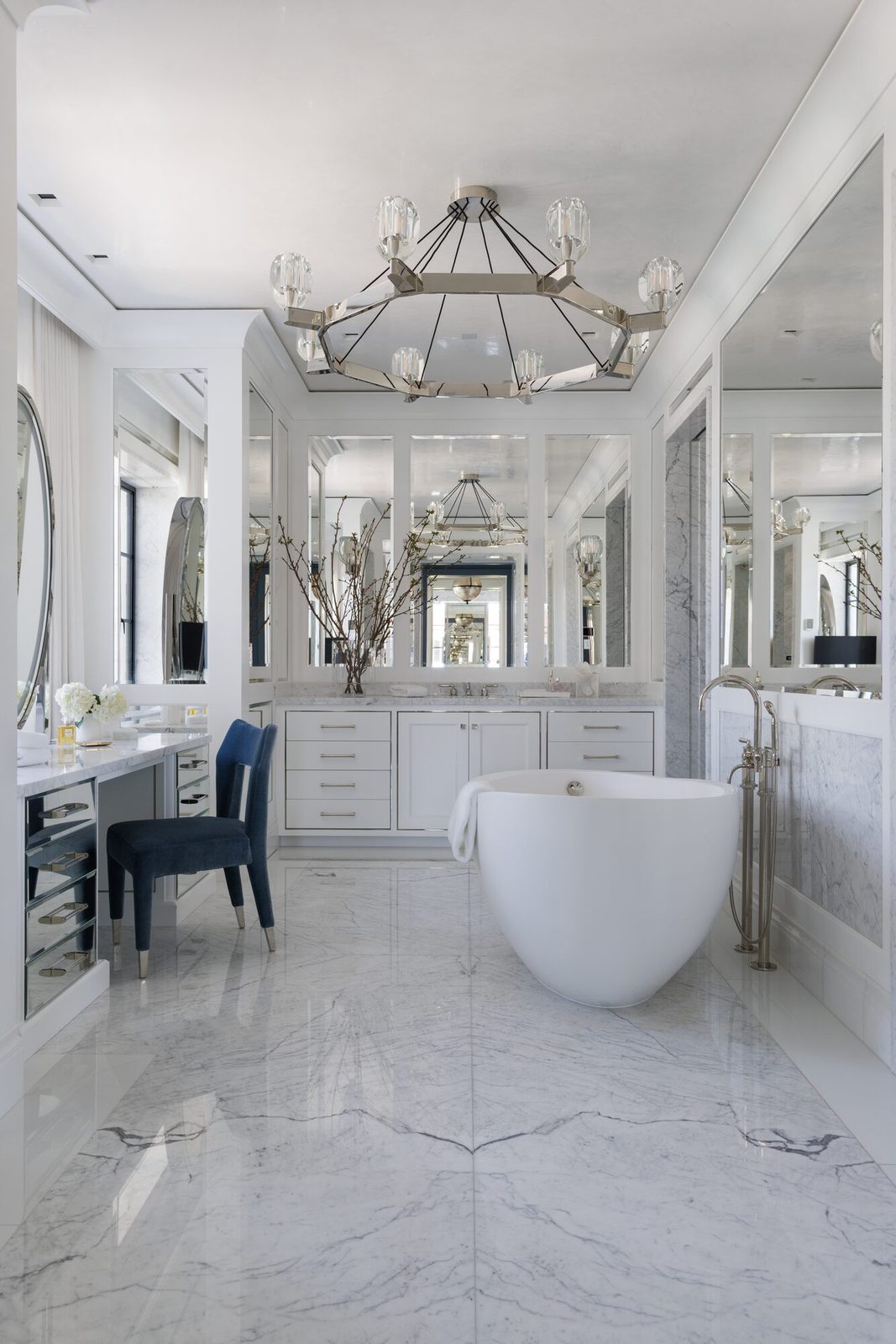 Styled luxury primary bathroom with marble walls and freestanding soaking tub — showing how editorial interior photography captures the atmosphere and material quality of a finished space
