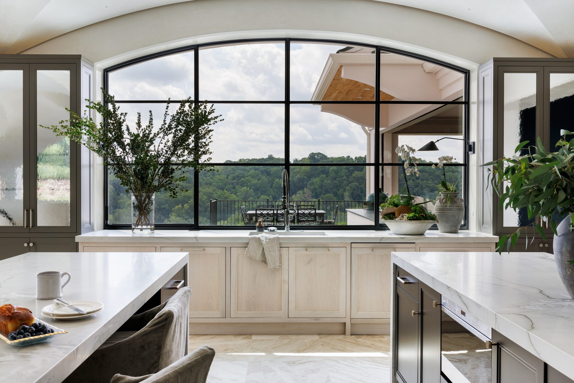 Atlanta interior design photography — luxury kitchen with arched window and custom cabinetry by Tomas Espinoza