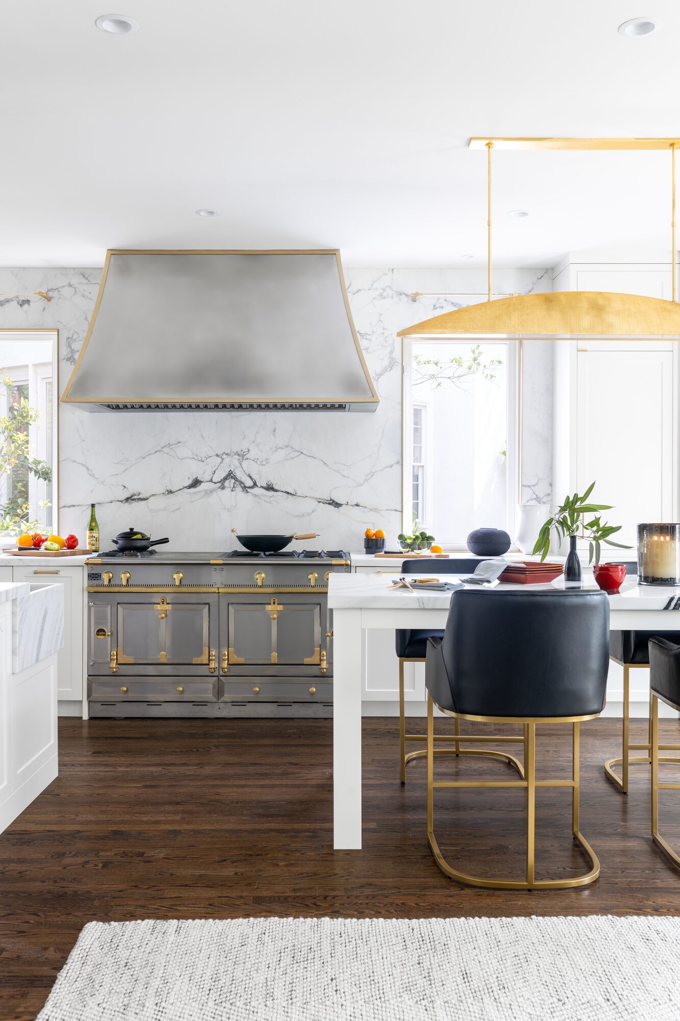 Luxury kitchen detail with French range and marble backsplash