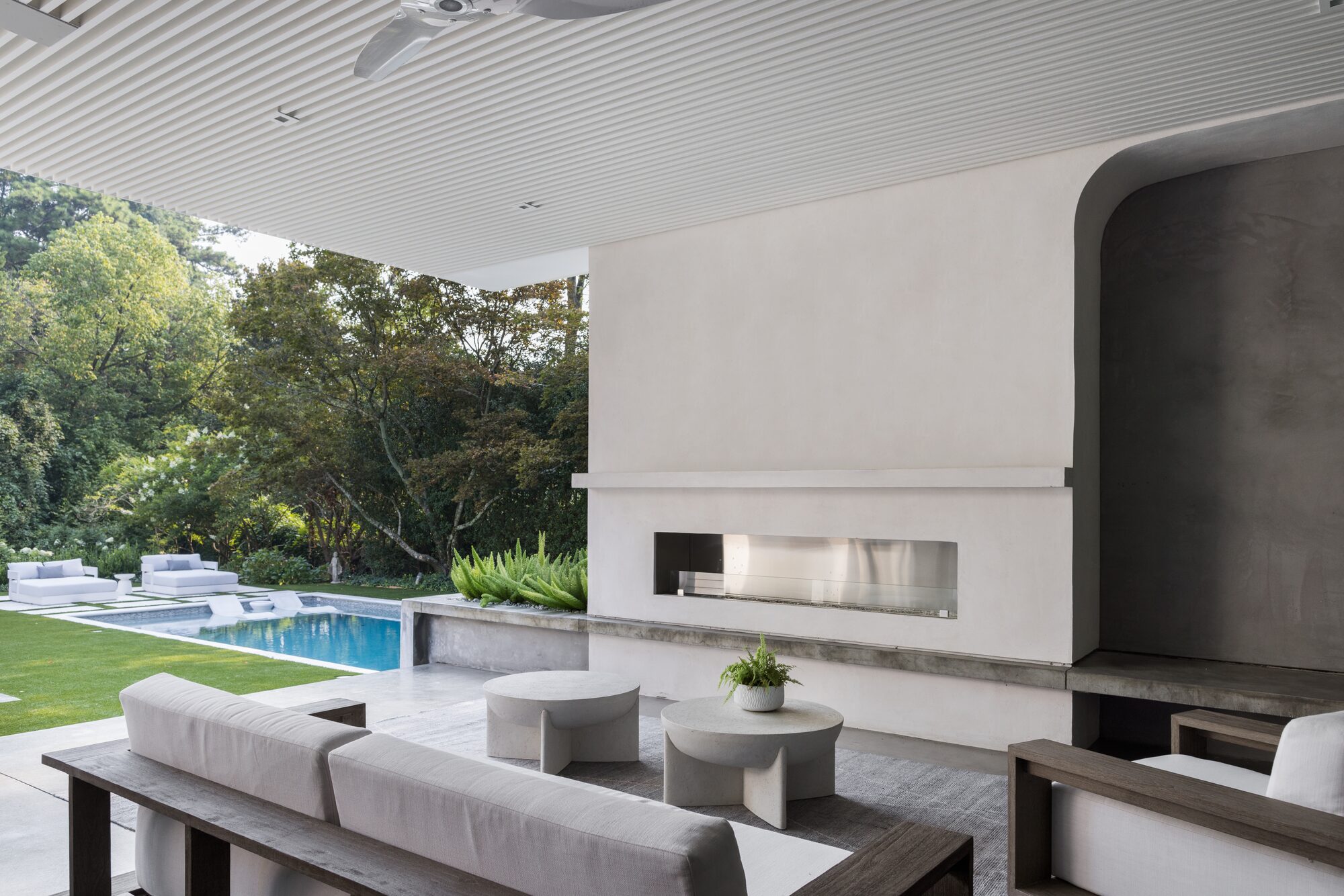 Residential wine room with arched entry and tasting bar